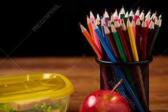 Back to School concept, school supplies, biscuits, packed lunch and lunchbox on white desk, selective focus, close-up.
