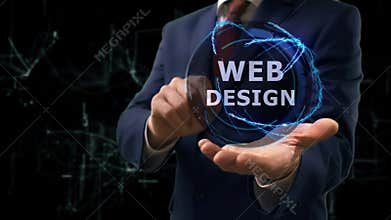 Businessman shows concept hologram Web Design on his hand