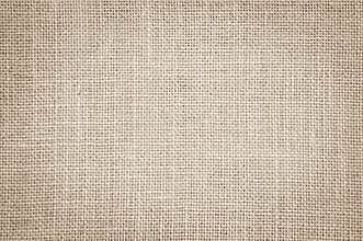 Pastel abstract Hessian or sackcloth fabric texture background.