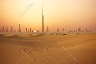 Skyline of Dubai at sunset or dusk, view from Arabian Desert