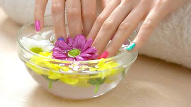 Female hands receiving spa procedure.