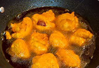 Akara being fried in oil; a popular food in Nigeria