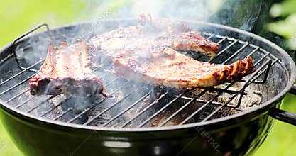 Preparing american bbq ribs on grill