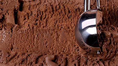 Chocolate ice cream scooped out of container