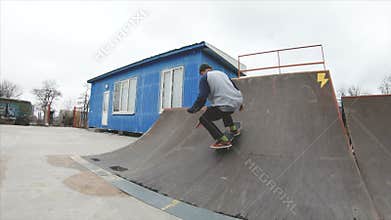 Skateboarding teenager man in skatepark extreme sport in slow motion 4K. Taken on Gopro 6 black