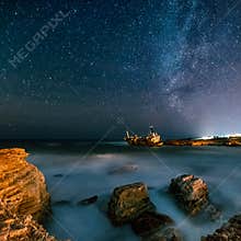 Abandoned ship Edro III near Cyprus beach at night.