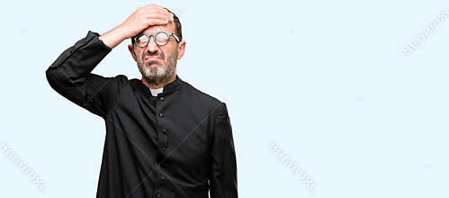 Handsome senior man isolated over blue background