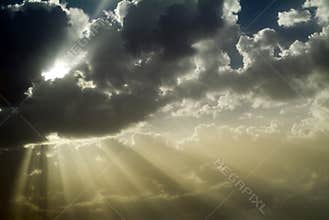 Sun rays behind clouds