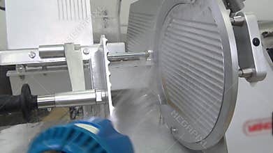 Cleaning and washing slicer from remnants of food.