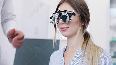 Eye Exam. Woman In Glasses Checking Eyesight At Clinic