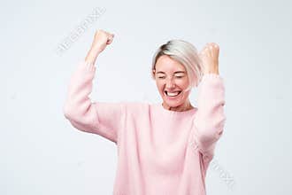 Winning success woman happy ecstatic celebrating being a winner. Dynamic energetic emotion of caucasian female model