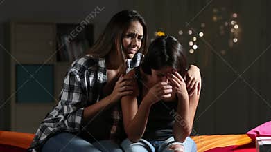 Bored friends wasting time at home in the night