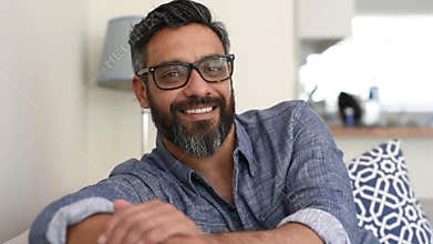 Joyful latin man at home