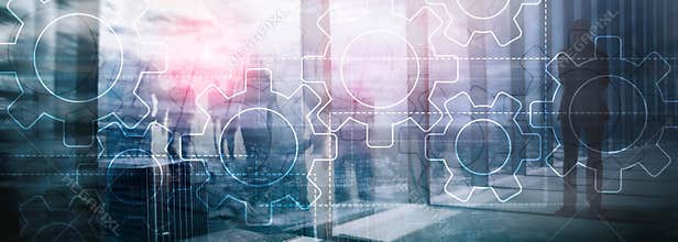 Double exposure gears mechanism on blurred background. Business and industrial process automation concept