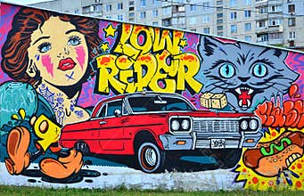 Fragment of an old wall with colorful graffiti painting