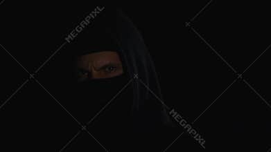 Aggressive arsonist slowly walking along parking lot looking for needed car