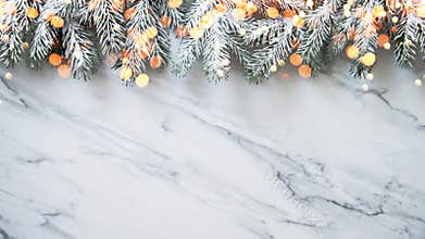 Christmas background with xmas tree on white marble background. Merry christmas greeting card, frame, banner. Winter holiday theme