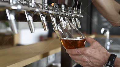 Pouring beer in glass