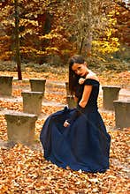 Girl in orange autumn forrest