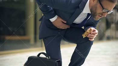 Director suffering from sudden stomach cramp, unhealthy nutrition effect, ulcer