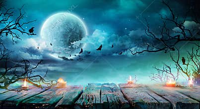 Halloween Background - Old Table With Candles And Branches At Spooky Night