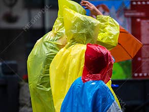 Colorful rain jackets in the rain