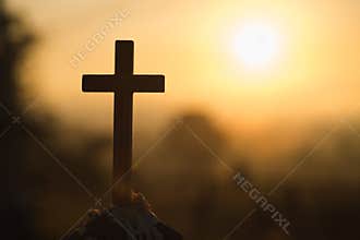 Christian wooden cross on a background with dramatic lighting, Jesus Christ cross, Easter, resurrection concept. Christianity,