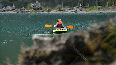 Caucasian Woman in the Inflatable Kayak