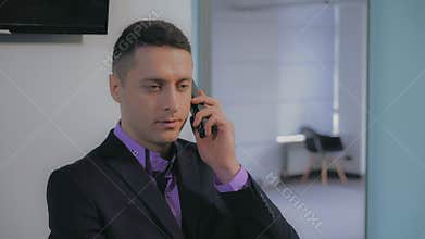 Man has phone conversation.