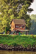 Small house on river