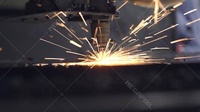 CNC Laser cutting of flat sheet metal steel material on a lathe with the program, modern industrial technology. bright