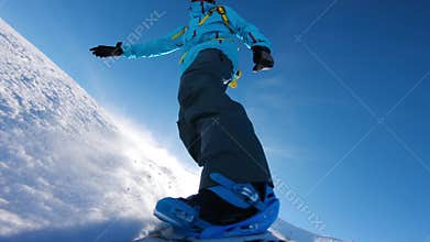 Snowboarder on track at Alpine mountains