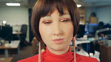 Female cyborg talking, close up.