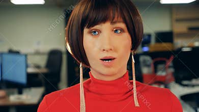 Female robot moving its face, close up.