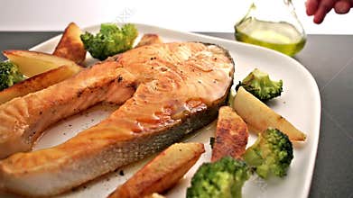 Meal with salmon fish steak and vegetable