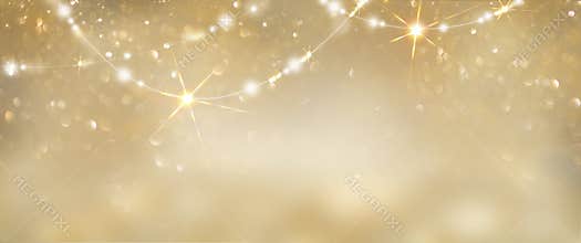 Christmas golden glowing background. Holiday abstract glitter defocused backdrop with blinking tars and garlands