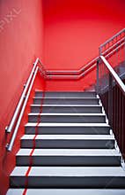 Stairs and red wall