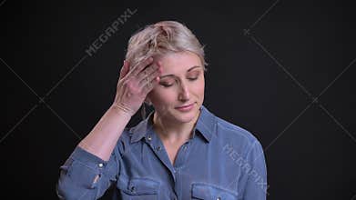 Closeup portrait of startled adult woman looking at camera being upset and nervous