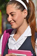 Portrait Of A Catholic Colombian Girl Student Wearing School Uniform With Books