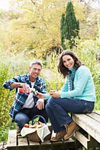 Couple Enjoying Picnic In Autumn