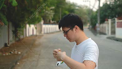 Asia man Stay beside and wear N95 mask for protect bad pollution PM2.5 dust in city