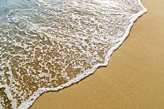 Wave running on the sand