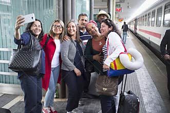 Brazilian tourists taking a selfie at the Padua train station