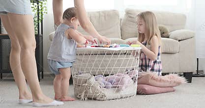 Mother with little daughter doing craft activity at home