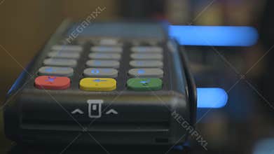 Closeup shot of customer pay over the wireless tradings card-reader. Adult human hands of businessman use bankcard
