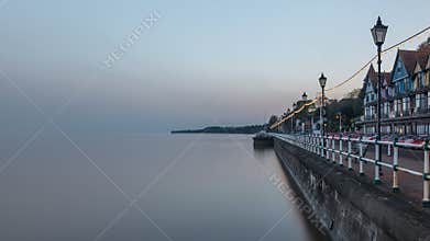 Penarth seafront, near Cardiff on the south Wales coast. It is evening and the tide is in