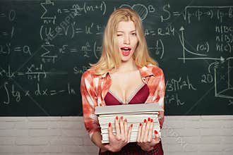 Back to, school. Young sensual student near chalkboard in school classroom. Tutor. First school day. First school day