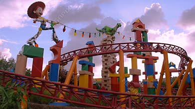 People enjoying Slinky Dog Dash rollercoaster at Hollywood Studios at Walt Disney World area.