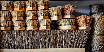 Stack of Wooden Bristle Brushes and Twine