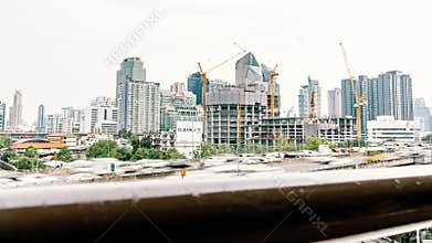 Time-lapse of construction site and car traffic in city, dolly reveal shot. Advanced building technology concept